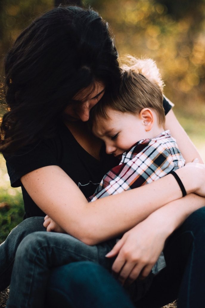 Woman Consoles Her Crying Child